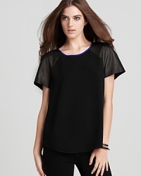 This stylish Rebecca Taylor tee dresses up the classic go-to crew with edgy mesh leather sleeves and an exposed back zipper--pair it with your denim skinnies or basic black.