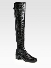 Head-turning boot of crocodile-embossed patent leather with an elasticized back panel for easy on and off access. Stacked heel, 1¾ (45mm)Shaft, 21Leg circumference, 13Crocodile-print patent leather with back elastic panelingPull-on styleLeather liningRubber solePadded insoleImported