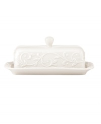 With an elegant white-on-white pattern featuring an embossed vine motif and radiant glaze, the Opal Innocence Carved covered butter dish gets your table set for refined dining every day.