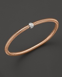 A single diamond station shines on this modern 18K rose gold mesh bangle from Roberto Coin.