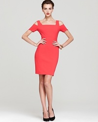 Show a subtle flash of skin in BCBGMAXAZRIA's Ann dress, detailed with open shoulders and rendered in a bold shade of lipstick red.