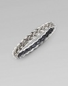 From the Woven Cable Collection. An elegant braid of sterling silver weaves textured and smooth strands into a sophisticated bangle. Sterling silver Diameter, about 2¼ Width, about ¼ Imported