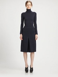 This chic, artfully tailored one-piece features a flattering culotte silhouette.TurtleneckLong sleevesPanel constructionInverted front and back pleatsConcealed back zipSilk liningAbout 44 from shoulder to hemWoolDry cleanMade in USA of Italian fabricModel shown is 5'10 (177cm) wearing US size 4. 