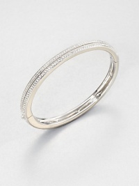 Double rows of sparkling pavé crystals encircle a classic hinged bangle with a modern square-edged design.CrystalRhodium platingDiameter, about 2½Width, about ¼Box-and-tongue claspImported