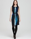 Take your 9-to-5 style to dramatic depths with a sleek Calvin Klein dress emboldened by a vibrant crush of color.