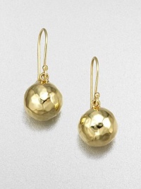 Wonderfully simple, wonderfully shimmering spheres of hammered 18k gold. 18k yellow gold Drop, about 1 Diameter, about ½ Ear wire Imported