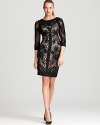 Rendered in ornately embroidered lace, this Sue Wong dress is at once demure and sophisticated.