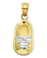 Commemorate your brand new bouncing baby boy. This precious charm features a baby shoe in 14k gold with rhodium laces. Chain not included. Approximate length: 1 inch. Approximate width: 2/5 inch.