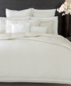 Swirling applique details rest on a pure silk ground in this decorative pillow from Donna Karan for a chic allure.