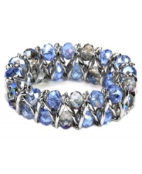 Slip on clusters of captivating colors with AK Anne Klein's stretch bracelet, with vibrant blue color glass beads. Crafted in imitation rhodium-plated mixed metal. Approximate diameter: 2-1/4 inches.