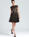 Metallic flecked lace lends a festive look to Shoshanna's L.B.D., detailed with delicate pleating for femininity.