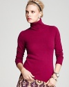 The ideal contrast to of-the-moment printed pants and colored denim, this C by Bloomingdale's turtleneck flaunts a classic silhouette in sumptuous cashmere for instant chic.