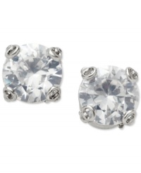 Lock up your new look. These stud earrings from Fossil showcase unique key shaped prongs that cradle a sparkling, round-cut cubic zirconia stone. Crafted in silver tone mixed metal. Approximate drop: 3/8 inch.