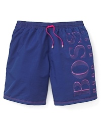 Catch the wave with an exciting contrast of colors on this fun-in-the-sun pair of swim trunks from BOSS Black.