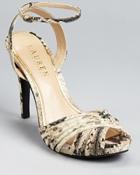 A strappy, snakeskin embossed silhouette from Lauren Ralph Lauren lends itself to daytime and after-hours alike.