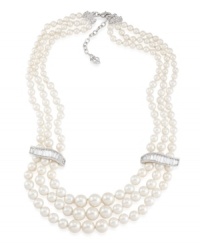 Let elegance define your look. Carolee's stunning three-row necklace features glass pearls accented by sparkling glass spacers. Set in silver tone mixed metal. Approximate length 18 inches + 2-inch extender.