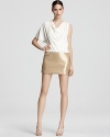 This Laundry by Shelli Segal dress features a gorgeously draped bodice punctuated by a sparkling sequin skirt.