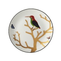 Embellished with a green-breasted woodpecker perched on a golden branch, this nature-inspired porcelain bread & butter plate from Bernardaud brings an elegantly fanciful look to your table.