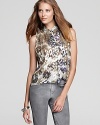 Rock the metallic trend we cheered sashaying down the runway with this new Joe's Collection top, lavished with a shiny floral print.