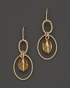 Faceted oval citrine adds rich sparkle to links of 14K yellow gold.