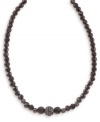 Go for dark drama with this sleek Carolee necklace. Graduated, faceted jet beads (8-10 mm) gleam alongside crystal-accented fireballs. Crafted in hematite-plated mixed metal. Approximate length: 16 inches + 2-inch extender.