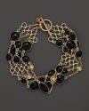 Two rows of black enamel stations and diamond accents highlight this bracelet from Roberto Coin.