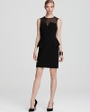 A sheer illusion top lends a sultry look against a sweetheart bodice on this little black Aidan Mattox dress.