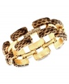 Sink your teeth into this chic bracelet from Ann Klein. The slip-on design features rectangular links covered in snake skin leather. Crafted in gold tone mixed metal. Approximate length: 8 inches.