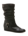 This cross between a slouch and moto boot has resulted in a distinctive, fashionable hybrid, from always-inventive Stuart Weitzman.