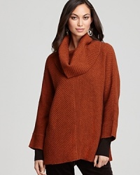 Ushering in a season of separates, this Eileen Fisher Petites sweater makes a bold statement with a swingy silhouette and an oversized cowl neckline.