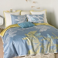 Etched motifs of blue birds resting on branches seem to float above a mosaic pattern in slate blue on our Icelandic Dream collection. Duvet is accented with, and reverses to, hemp yellow and finished with an ivory tailored flange. Set includes duvet cover.