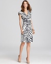 A wild zebra print takes to a tame Lafayette 148 New York sheath for a refined walk on the wild side.