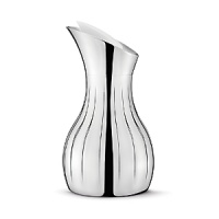 The Georg Jensen Legacy collection is a perfect illustration of how a more decorative style incorporated into modern design can result in a gorgeous piece - the smooth, curved surfaces are mirroring their surroundings in a world of glittering sumptuousness. The Georg Jensen Legacy pitcher is ideal for pouring water or juice, for example. The decorative grooves provide a firm grip while the pitcher insulating design ensures that ice water stays cold for a while. The Georg Jensen Legacy pitcher is made of stainless steel and comes with an elegant white stopper.