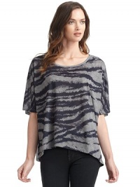 THE LOOKScoop necklinePullover styleShort dolman sleevesFront zebra print with solid contrast backAsymmetrical hemLeft vented hemTHE FITLoose fit silhouetteAbout 29 from shoulder to longest point of hemTHE MATERIALPolyesterCARE & ORIGINMachine washImported