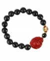 Eastern expressionism. This beautifully-themed bracelet features black onyx beads (84 ct. t.w.), a beaded cloisonné accent and a carved cinnabar buddha. Bracelet stretches to fit wrist. Approximate length: 7-1/2 inches.