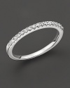 An elegant diamond ring in 14 Kt. white gold that can be worn stacked.