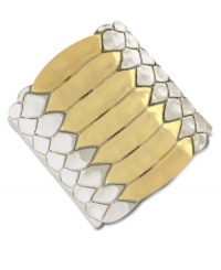 Coil your wrists with reptilian style. Vince Camuto's cuff bracelet features snake textured detail. Crafted in silver tone and gold tone mixed metal. Approximate length: 6 inches.