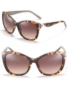 Western-inspired cat eye sunglasses with contrast interior and studded sides.