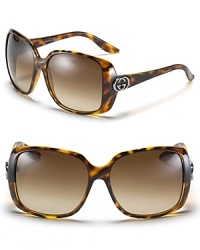 Oversized rectangle sunglasses with signature Gucci logo embellishment at temples.