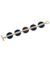 Bold blues from Kenneth Cole New York. The blue beaded discs complement the golden stripe that runs across the middle of this toggle bracelet. Crafted in gold tone mixed metal. Approximate length: 8 inches. Approximate width: 1 inch.