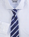 A slim, tailored fit in cotton with fine blue checks. Buttonfront Spread collar Cotton Dry clean Imported 