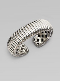 A substantial cuff in a textural design. Sterling silver Kick mechanism closure Diameter, about 2½ Imported 