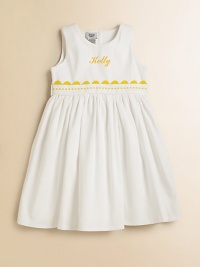 A classic look for adorable girls everywhere, shaped from soft cotton piqué with a ribbon waist and yellow rick-rack trim. Back button closure Gathered empire waist Cotton Machine wash Made in USA FOR PERSONALIZATION Select a quantity, then scroll down and click on PERSONALIZE & ADD TO BAG to choose and preview your personalization options. Please allow 2 weeks for delivery.