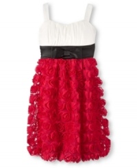 A unique textured skirt and a classic empire waist give this Ruby Rox dress its beautiful style.