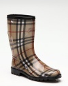 Traditional signature check and prorsum horse-printed fabric are covered in clear rubber for waterproof protection.Rubber heel, 1 (25mm) Shaft, 9¼ Leg circumference, 14 Round toe Leather trim at top Pull-on style Padded insole Rubber lug sole Made in ItalyOUR FIT MODEL RECOMMENDS ordering true whole size; ½ sizes should order the next whole size down. 