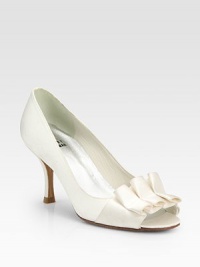 Chic satin elegance distinguished by a hand-ruched bow and pretty peep-toe silhouette. Self-covered heel, 2½ (65mm)Satin upperLeather lining and solePadded insoleImported