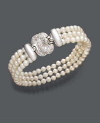 Complement your evening wear with this stunning accessory. Belle de Mer bracelet features three polished rows of cultured freshwater pearls (4-5 mm) and a sterling silver and diamond-accented clasp. Approximate length: 7-1/2 inches.