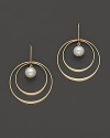 Beautiful textures in 14 Kt. yellow gold. A double hoop earring with fresh water pearl center.