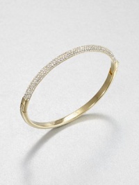 From the Brilliance Collection. Half of this graceful bangle is paved with sparkling rhinestones, the other half has a smooth, polished finish, with a handy hinge in between.GlassGoldtoneDiameter, about 2.5Hinged with push-lock claspImported