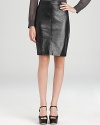 A careerist staple gets contemporary edge as sleek leather outfits a classic DKNY pencil skirt. Style with a concert tee and sharp blazer for a modern 9-to-5 statement.